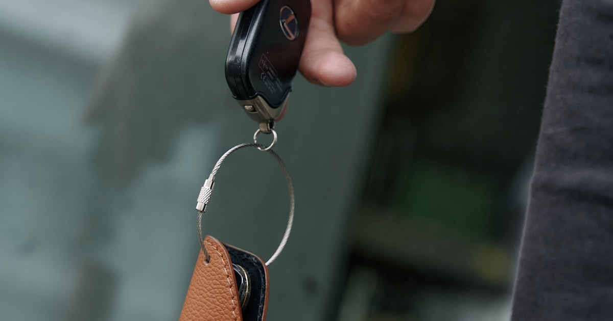 Person holding car keys ready to return a rental car in Singapore