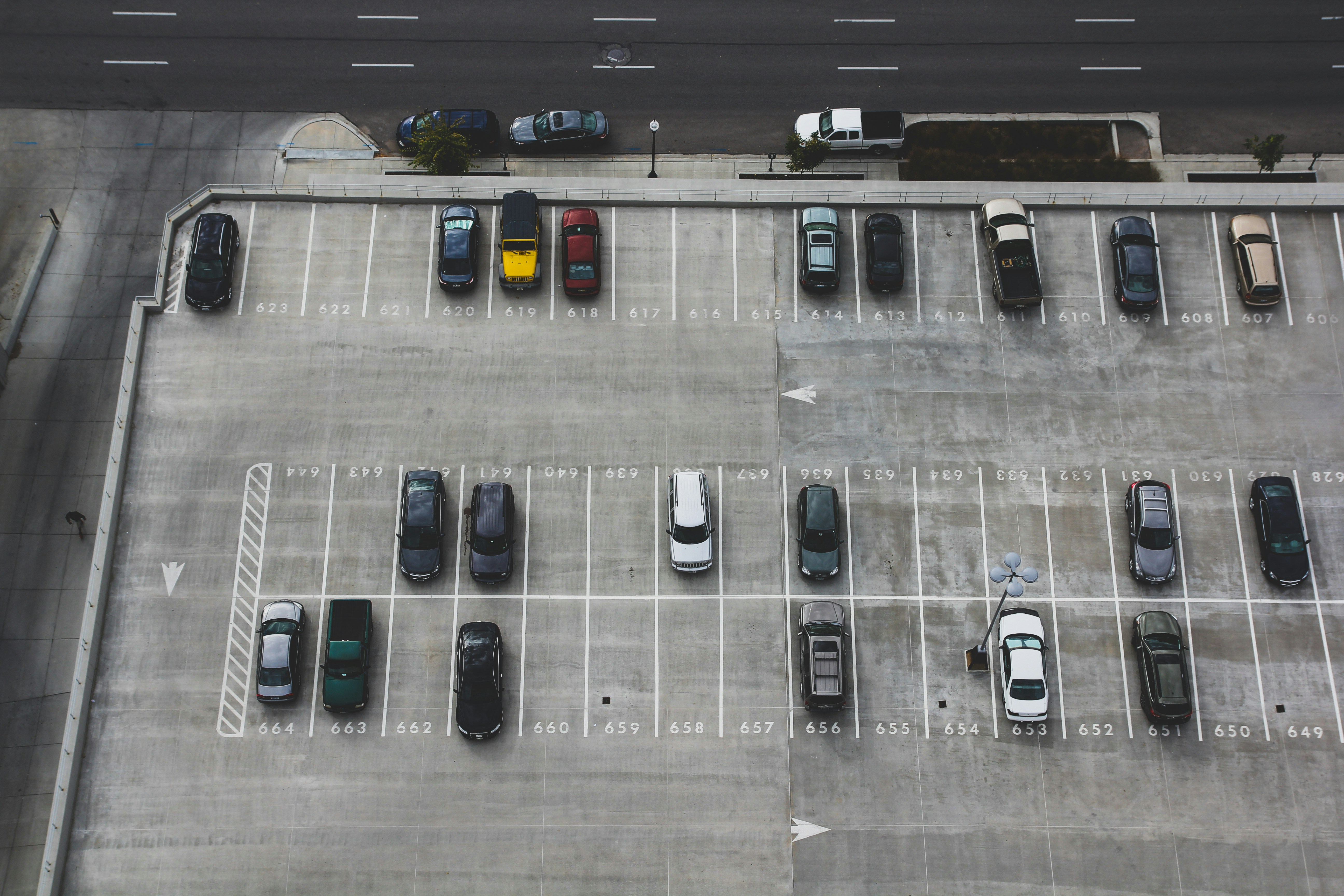 Company cars parked in a row at a Singapore corporate office building