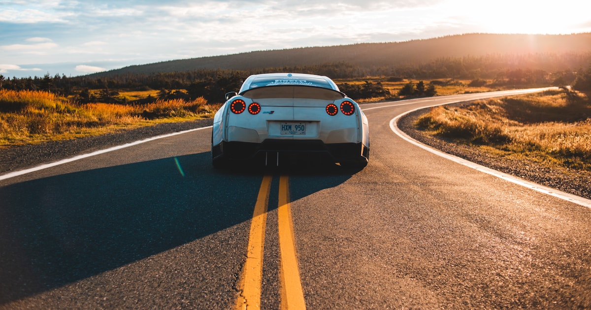 Modern sedan parked outside a corporate office building representing business car rental in Singapore